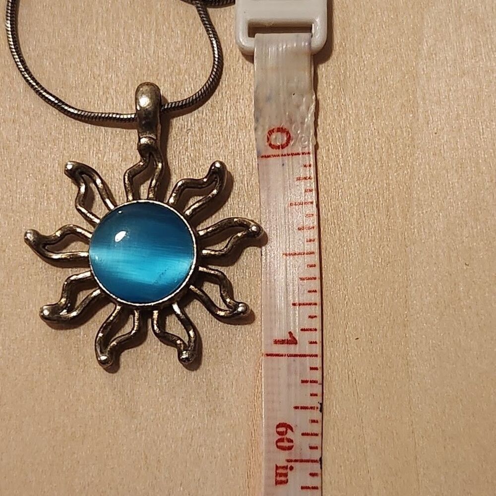 Silver Tone Sun Necklace Blue Glass Center Modern Pendant